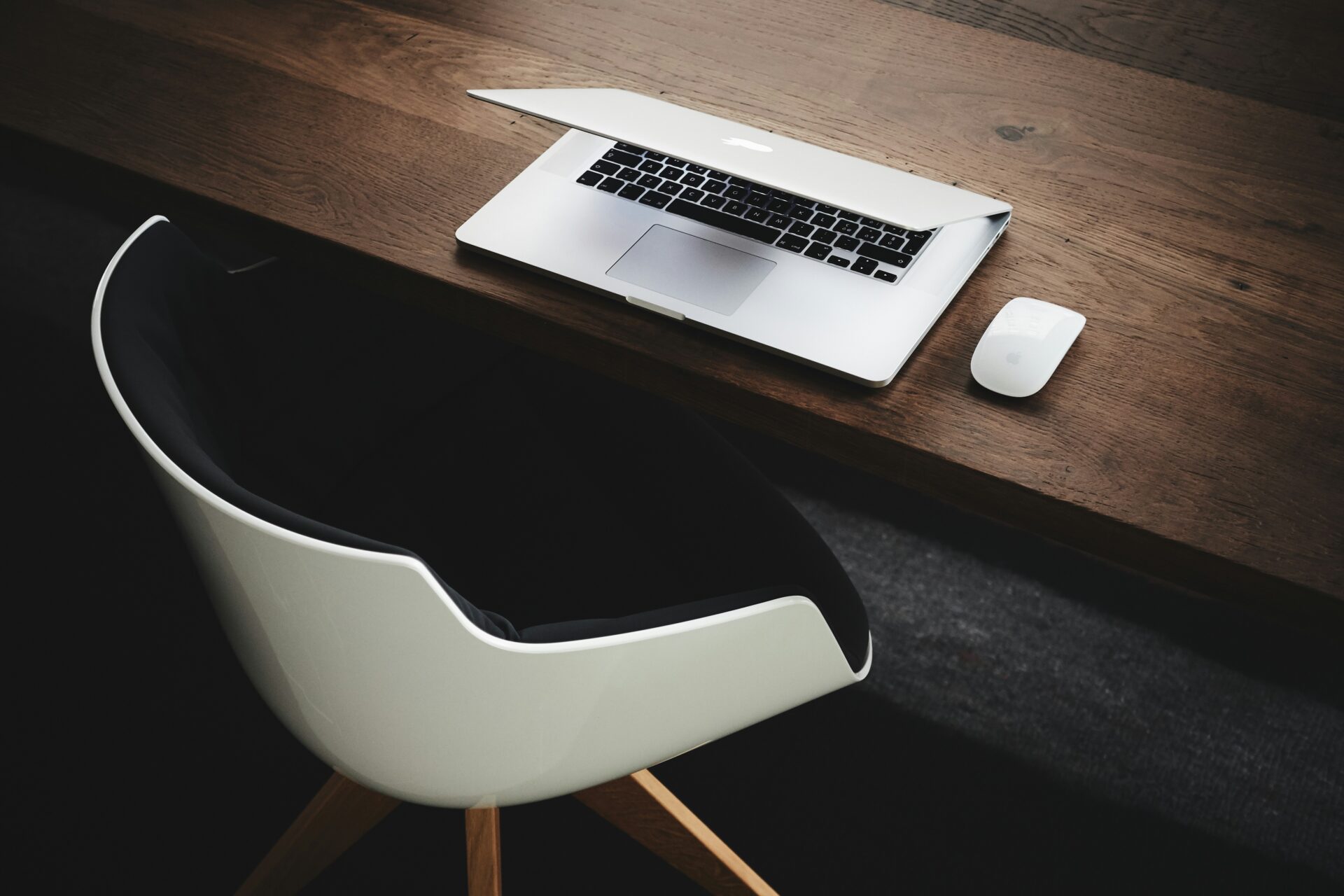 Image of laptop and chair at a desk to represent why choose a boutique consultancy