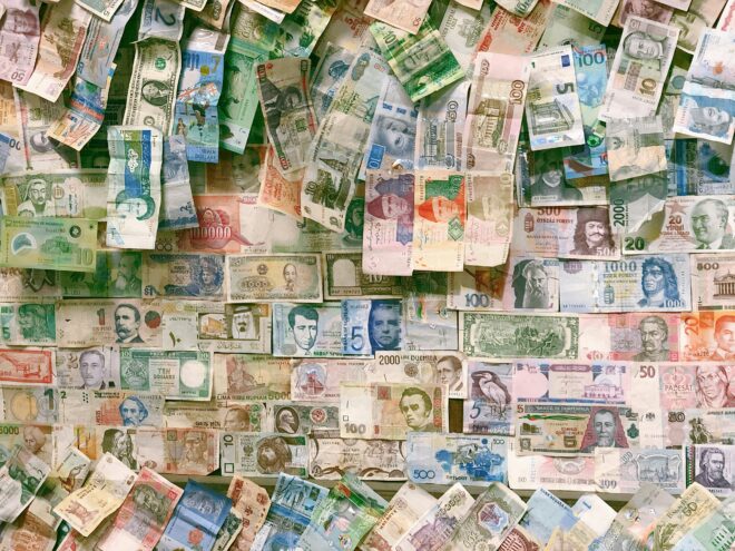 Photo of different currency used in a blog on market entry strategy